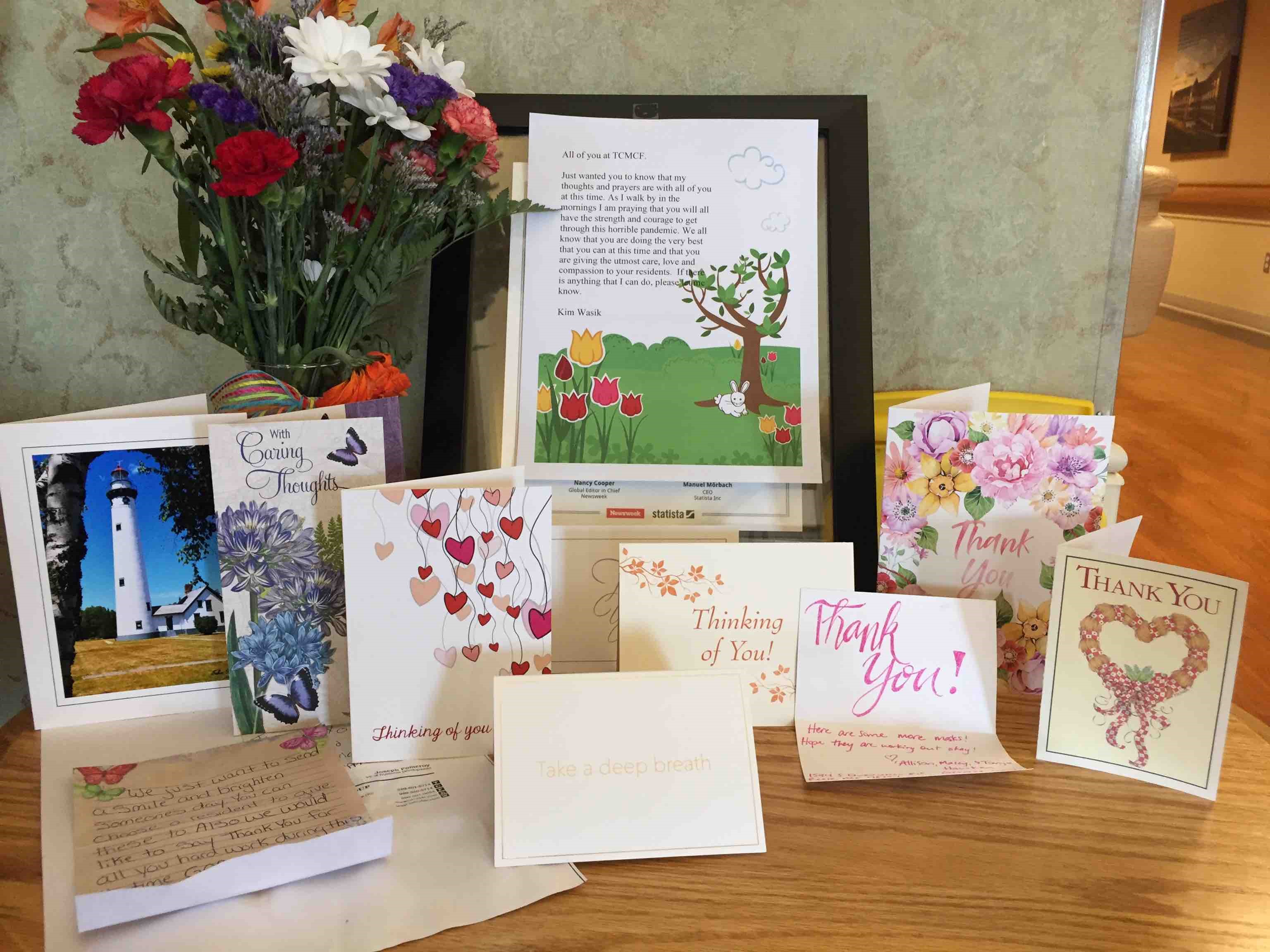 Cards from family displayed on a table.